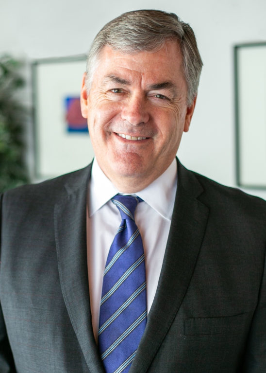 headshot of john grady smiling